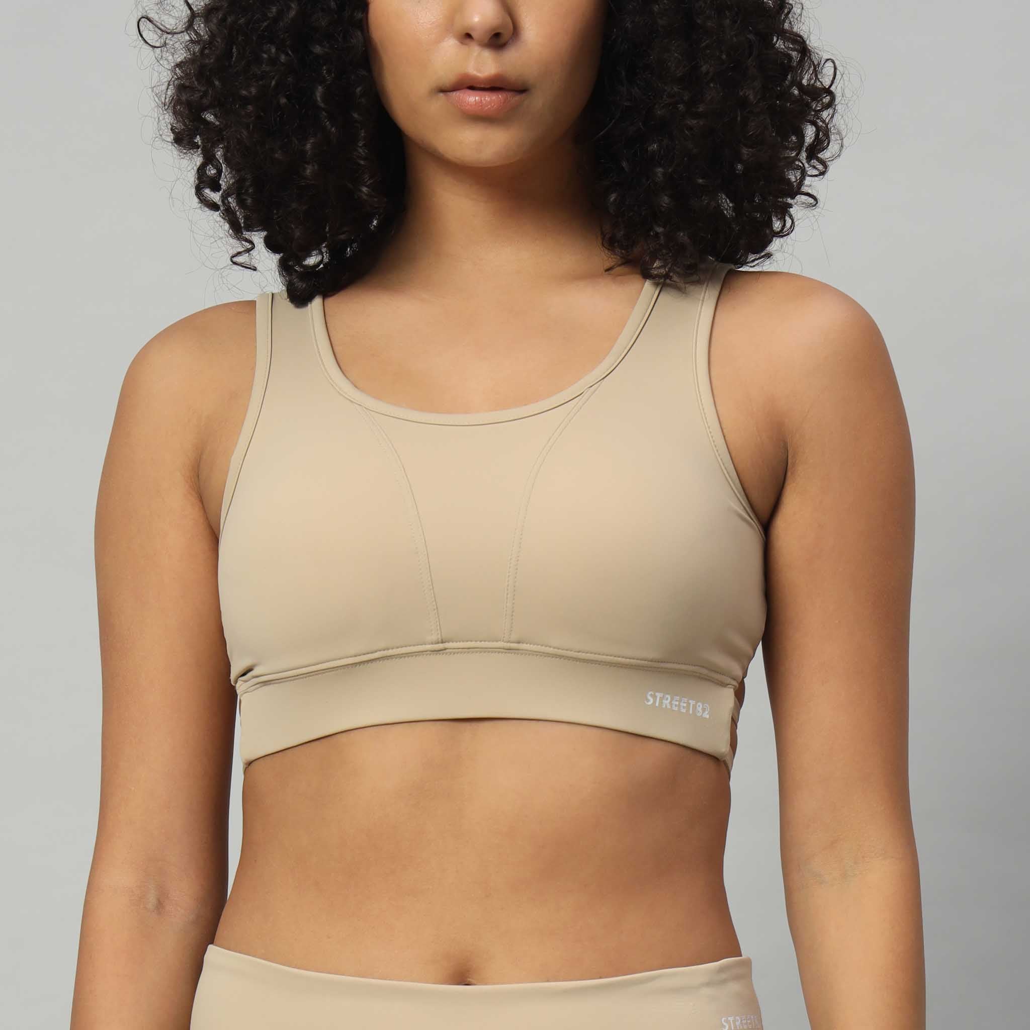 Front view Dry Fit Sports Bra Top with Criss Cross Back Cream Colour variant.